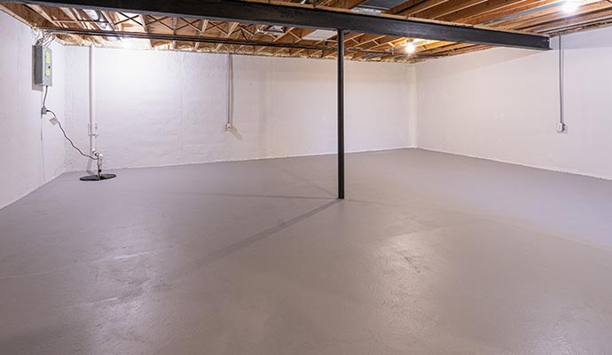 Basement floor waterproofing system in a clean open basement