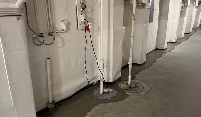 Basement sump pump systems
