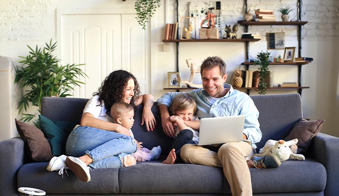 happy family sitting on the couch enjoying fresh air