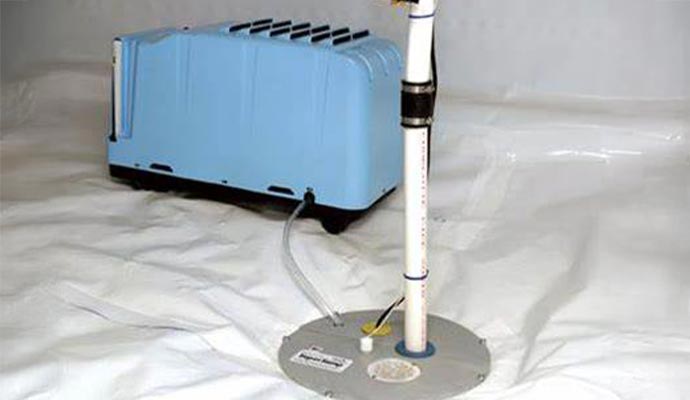 An industrial dehumidifier and sump pump system in an encapsulated crawl space