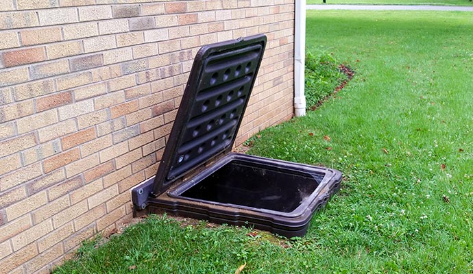 Installed exterior crawl space access door