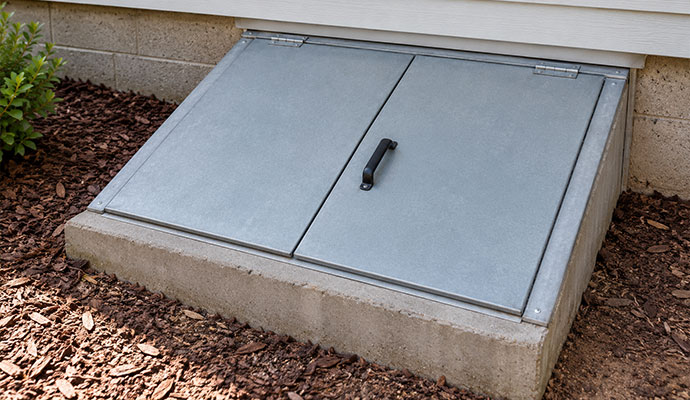 Slanted crawl space hatch door