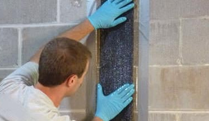 An expert repairing cracked wall