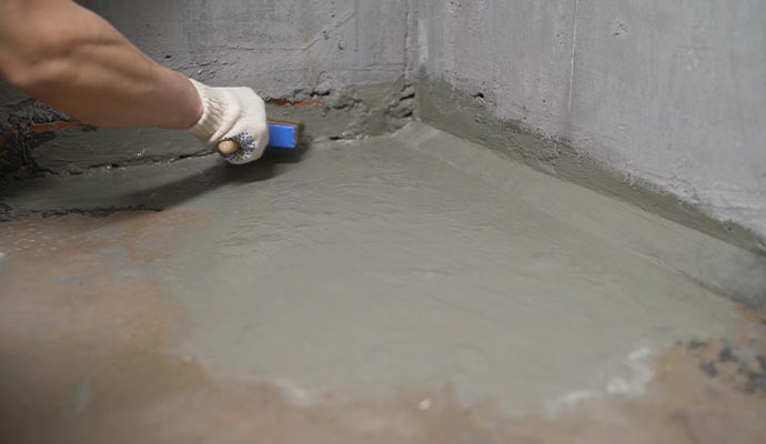 Person repairing foundation floor