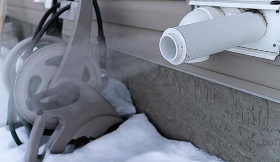 frozen discharge lines furnace exhaust pipe in winter