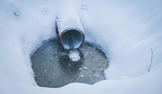 frozen pipe in a forest frozen discharge lines