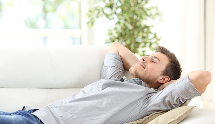 A man relaxing in living room A man relaxing in living room