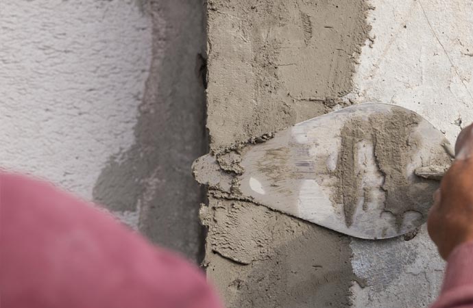 Professional repair of reinforced concrete walls using shearing technique.