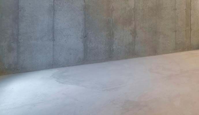 Basement wall and floor repair service completed