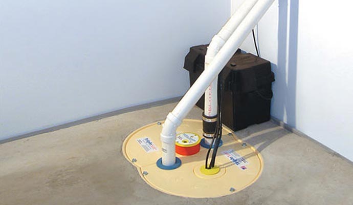 Sealed sump pump system installed in a basement floor