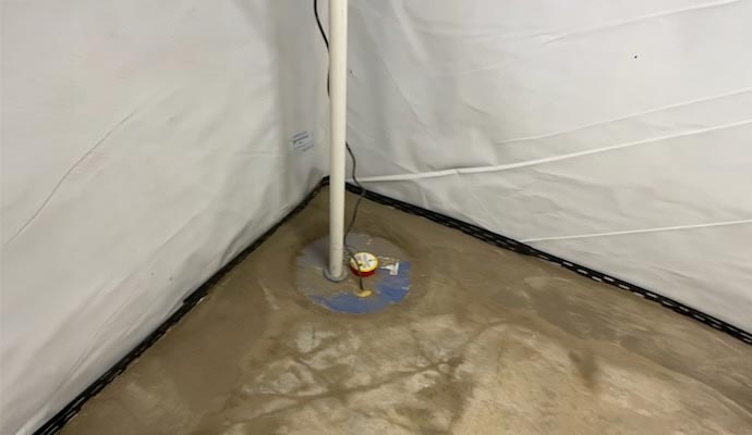 Newly installed sump pump in basement corner for waterproofing