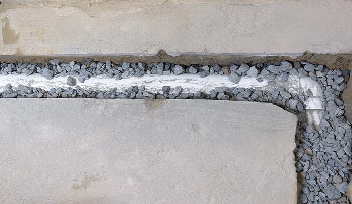 Interior footing drain system