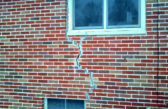 Wall crack beside a window