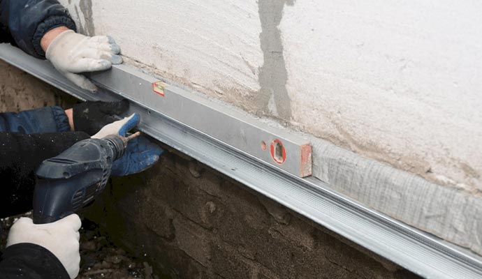 worker repairing foundation in indianapolis